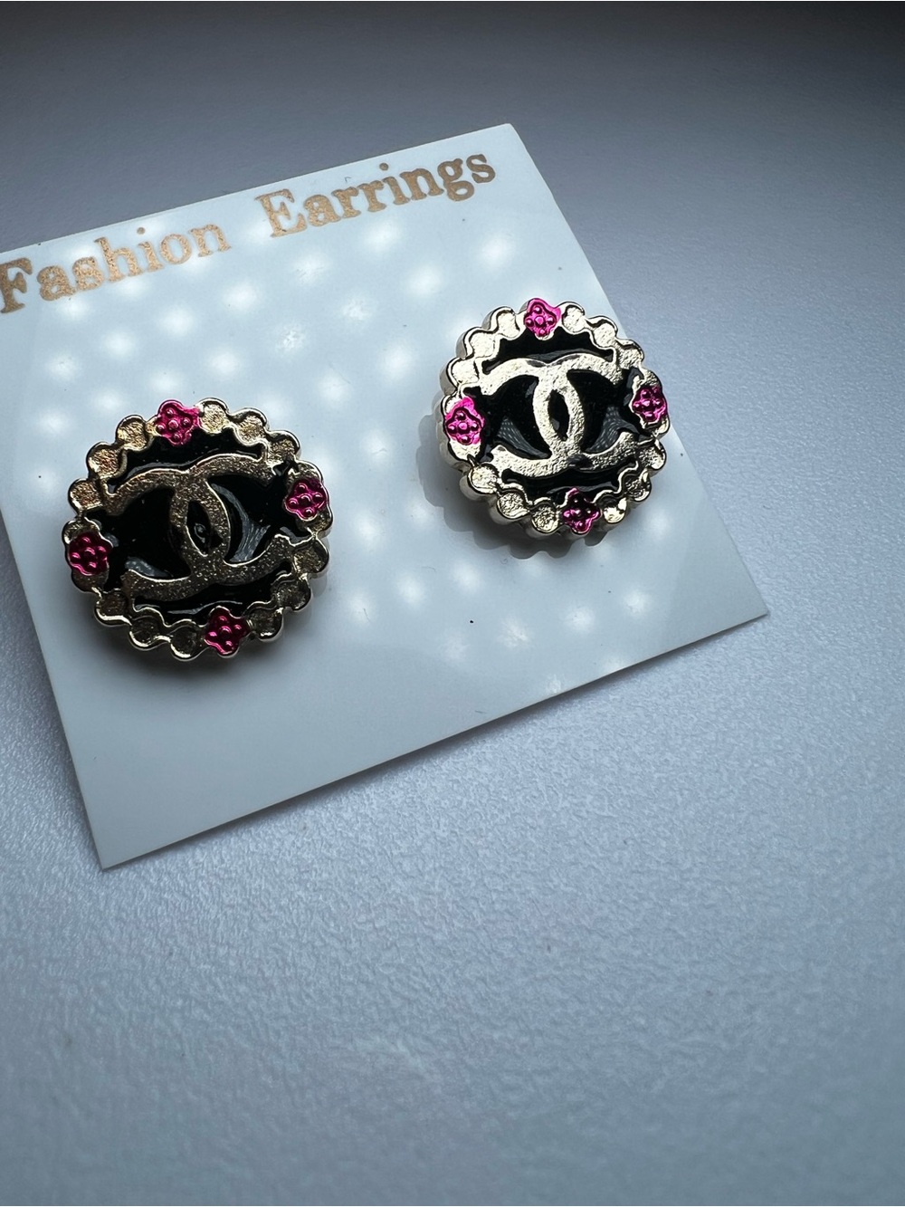Inspired black enamel and gold tone stud earrings
